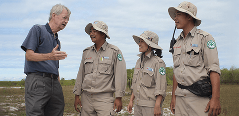In central Vietnam, US veteran Chuck Searcy (left) discusses bomb disposal with members of Project Renew. (Photo courtesy Project Renew)