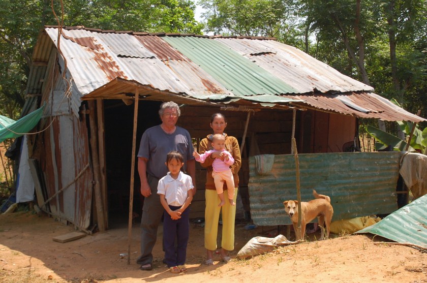Mike Boehm with a family in Tinh Giang commune, Quang Ngai. MQI is working on getting this family a compassion house. (Photo courtesy of Phan Van Do)