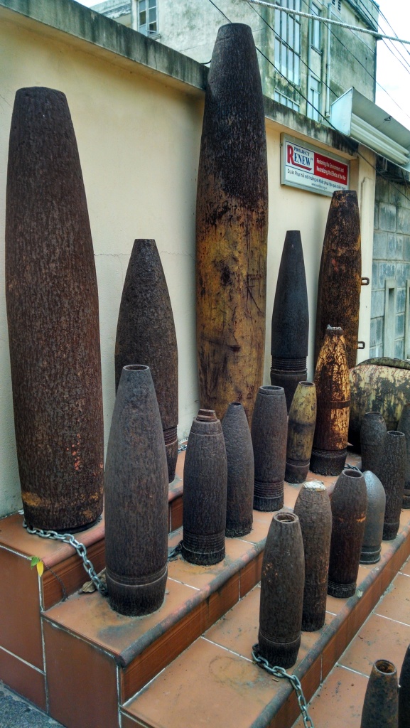 An exhibit of unexploded ordnance in the parking lot of Huu Nghi Hotel, where I was staying in Dong Ha. (Photo by Nissa Rhee, June 2014)
