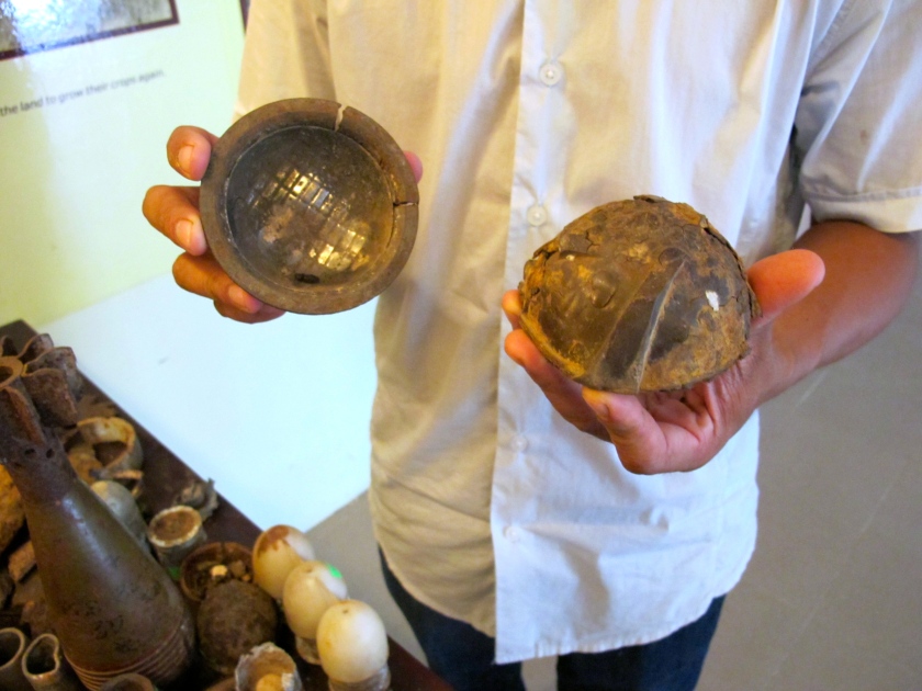 Project Renew's Nguyen Thanh Phu shows me the remnants of a cluster bomblet. (Photo by Nissa Rhee, June 2014)