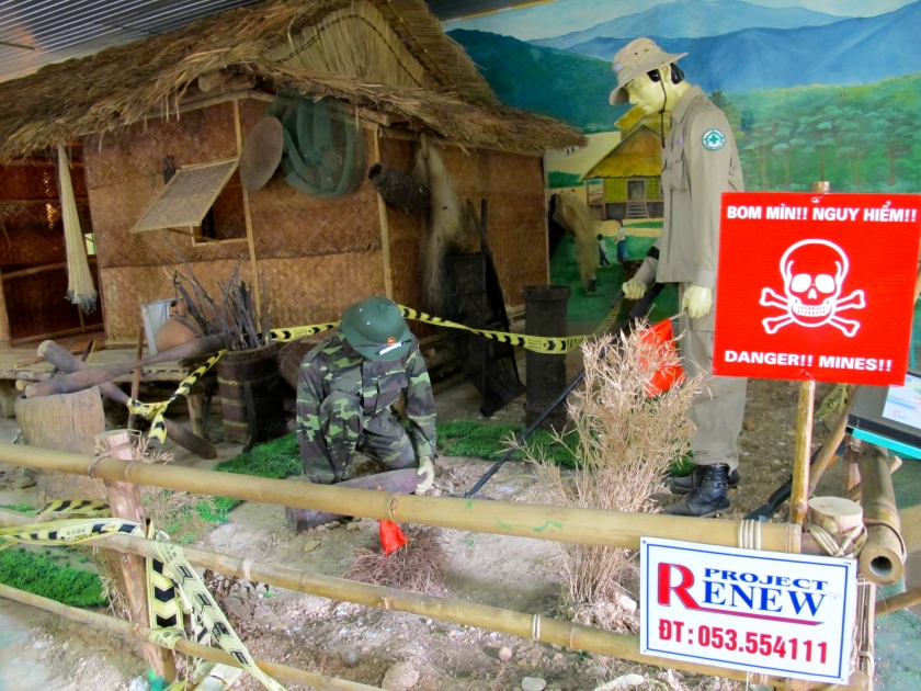 A diorama at the Project Renew Visitor Center shows how UXO is cleared near people's homes. (Photo by Nissa Rhee, June 2014)