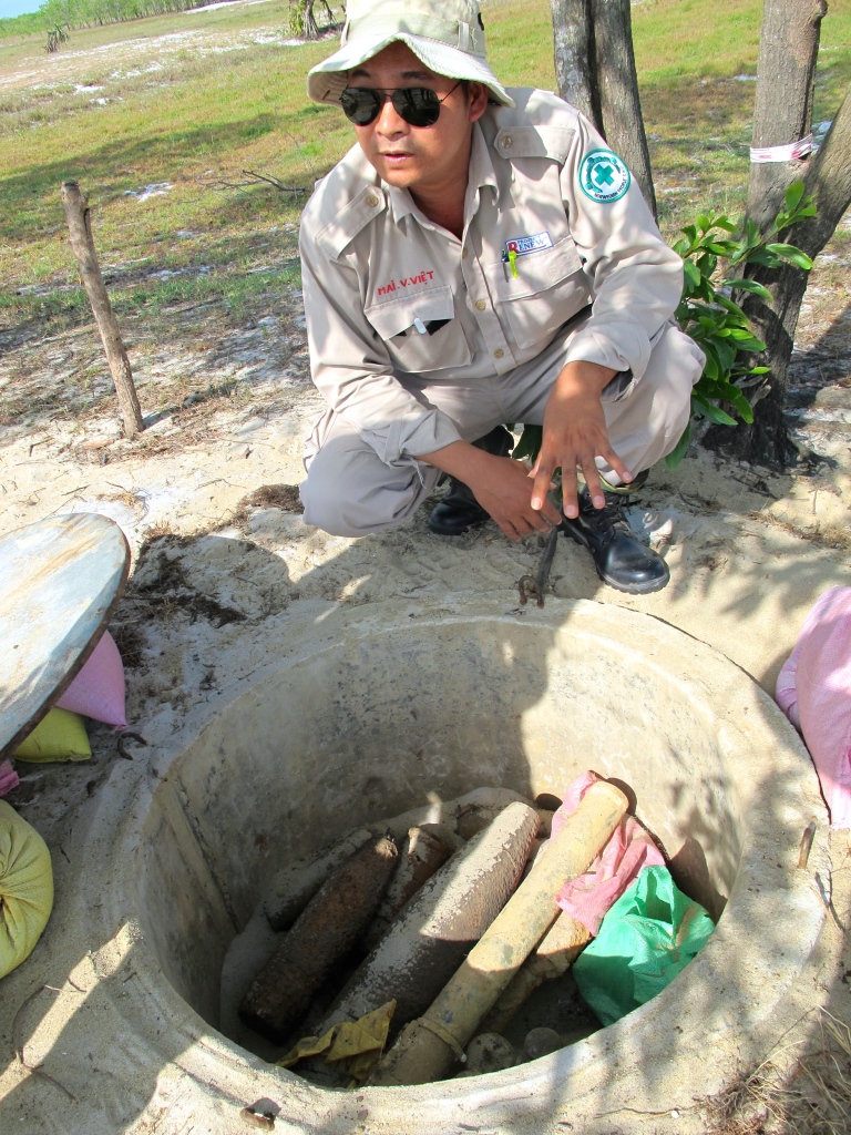 Viet shows me the dump where they store conventional UXO before they destroy it. (Photo by Nissa Rhee, June 2014)