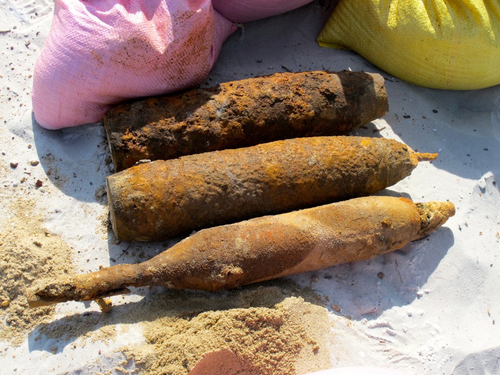 When an EOD team is ready to destroy ordnance, they move the bombs to a special sand-filled staging area. (Photo by Nissa Rhee, June 2014)