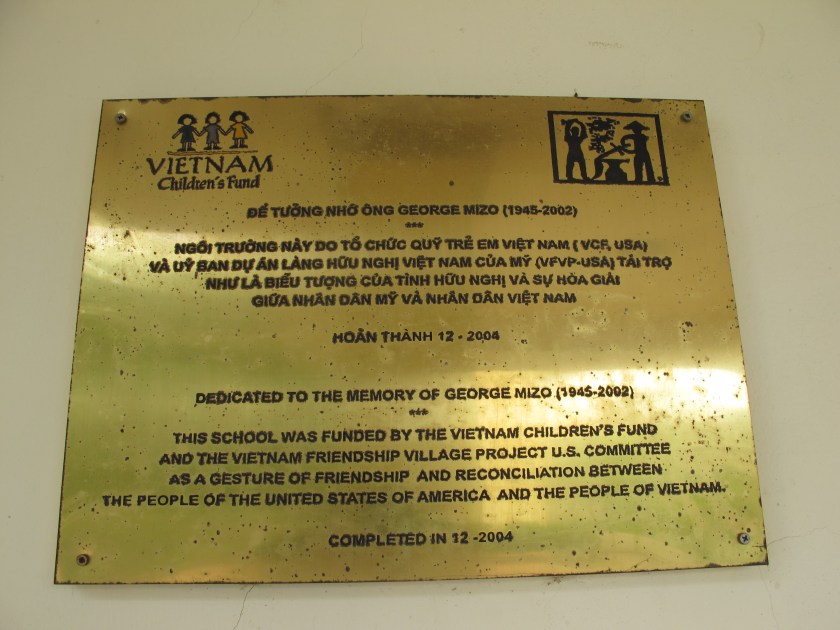 Plaque in front of Friendship Village's main school