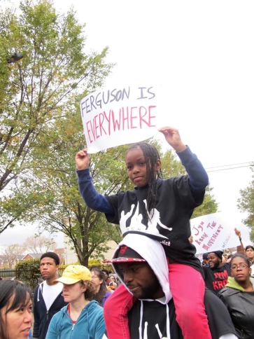A young protester at the march on Saturday. (Photo by Nissa Rhee).